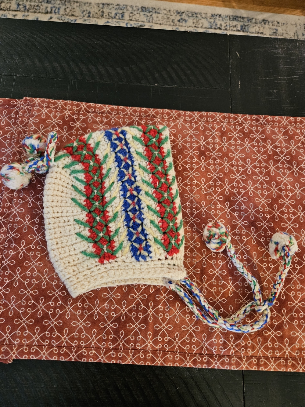 Cream Crochet Earflap Kids Hat with Red, Green & Blue Accents